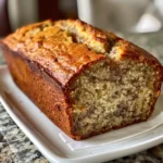 Slices of soft and fluffy honey vanilla banana bread on a white plate.